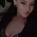 Las Vegas escort Lexi takes a close-up selfie in black lace lingerie.